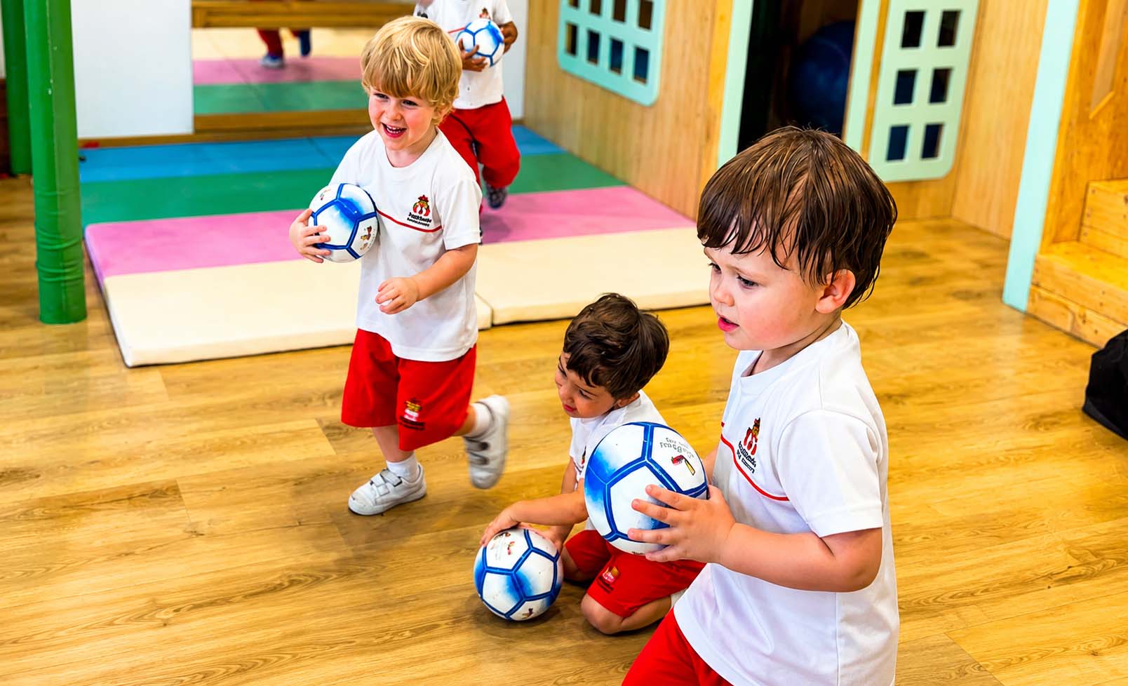 Kids with soccer balls